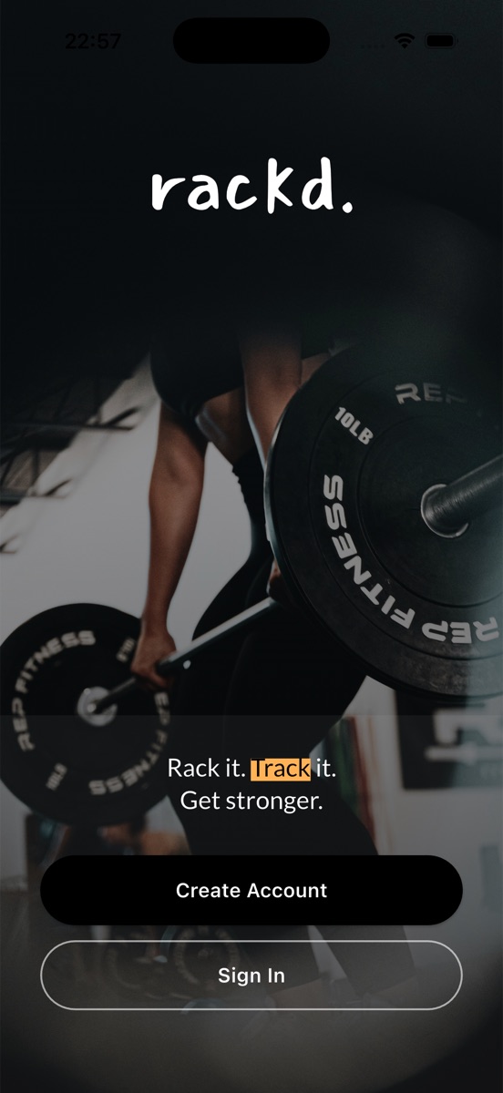 The rackd. opening screen: the wordmark over a photograph of a lifter pulling a loaded barbell, above the line Rack it. Track it. Get stronger.
